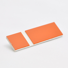 Orange-hvit graveringsplate