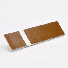 Brun-hvit graveringsplate